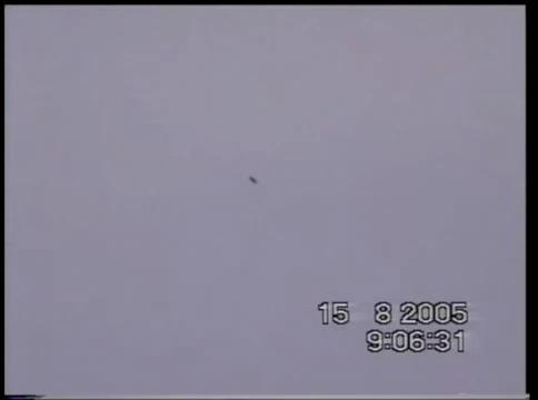 15-08-2005 BLACK METALLIC LOOKING UFO ROLLING THROUGH THE SKY GUISBOROUGH UK 20-30 FEET IN SIZE